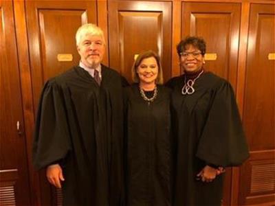 Judge Sheehan with Justice Michael Donnelly and Justice Melody Stewart.