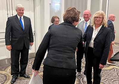 Judge Mary J. Boyle Sworn shaking hands with a woman in the Ohio Courts of Appeals Judges Association